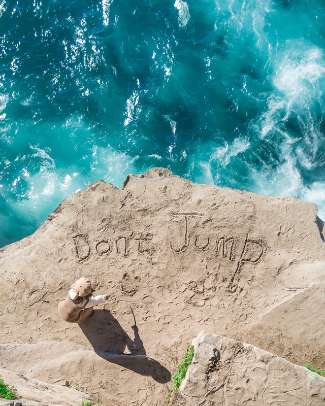 top view photo of person on seashore